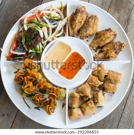 Fried pork dumplings wrapped, Fried chicken,preserved egg salad, food of thailand