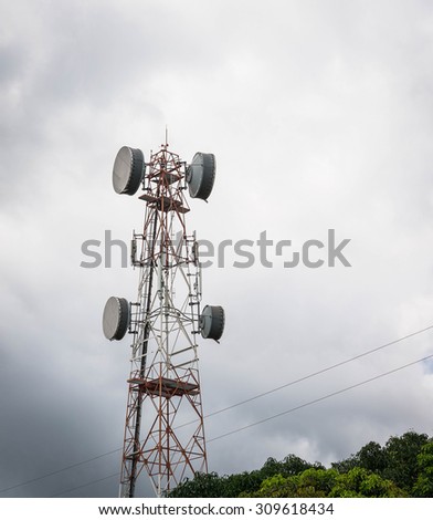 Telecommunications tower. Mobile phone base station and cloudy rain