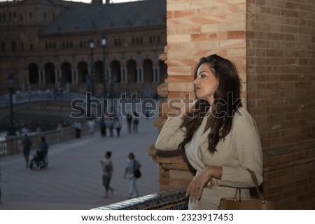 Similar – Image, Stock Photo Gorgeous woman touching columns in park