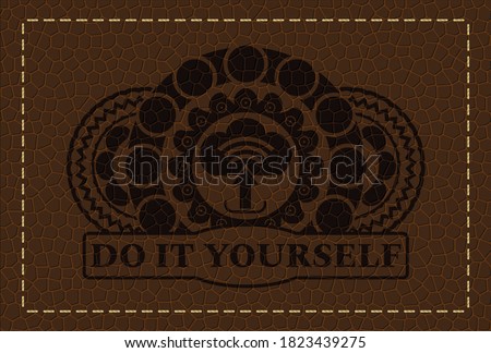 upload icon and Do It Yourself text leather emblem. Wallet fancy background. Artistic illustration. 