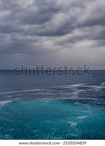 Similar – Image, Stock Photo Lonely yacht in gray water with dark mountains under cloudy sky