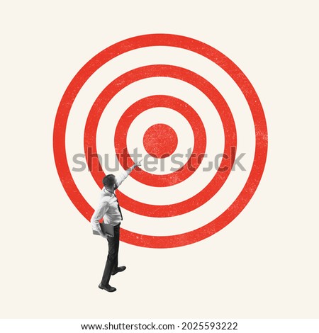 Goal, task. Young man, office worker, employee standing in front of target isolated on light background. Concept of finance, economy, goals, achievements, occupation. Copy space for ad