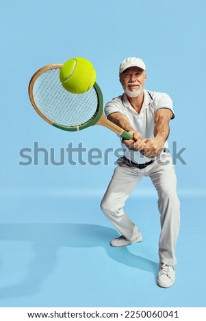 Similar – Image, Stock Photo Senior man playing tennis in gym