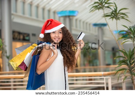 Christmas Shopping. Beautiful Happy Girl With Credit Card In Shopping Mall. Shopping Bags.