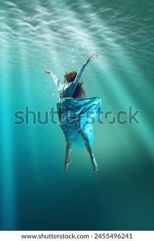 Similar – Image, Stock Photo Graceful woman dancing in sandy desert