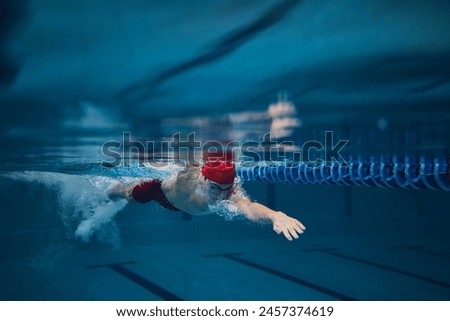 Similar – Foto Bild Mann schwimmt im Pool, blaues Wasser