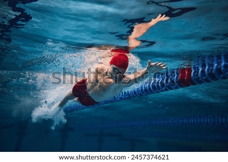 Similar – Foto Bild Mann schwimmt im Pool, blaues Wasser