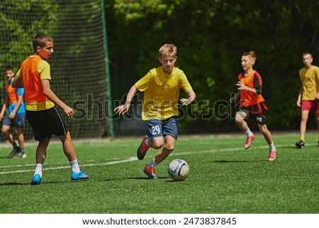 Similar – Foto Bild junger Fußballspieler läuft über den Fußballplatz