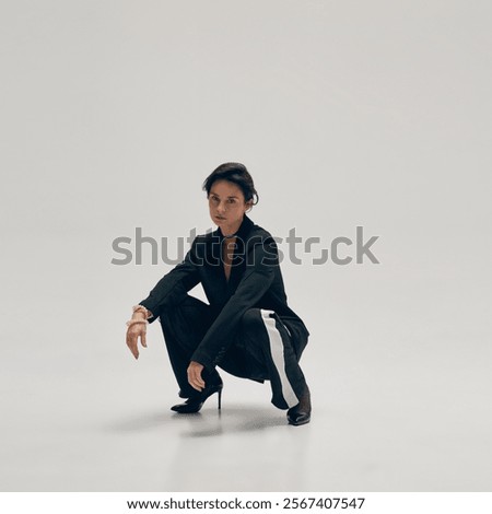 Similar – Image, Stock Photo Elegant woman sitting against brick wall