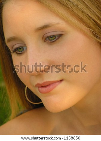 Close-up of teenager looking off in dreamy manner