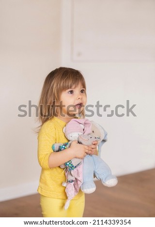 Similar – Image, Stock Photo A cute girl plays on her phone while her sister does her homework. Communication, social distance during quarantine. Distance learning, online education