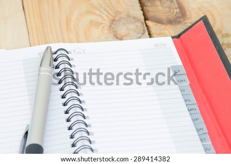 blank phone book on textured wood background