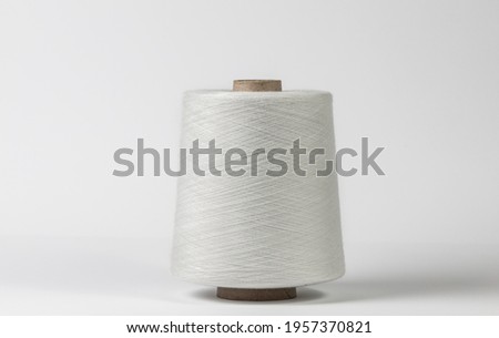 Textile white spool on isolated white background Imagine de stoc © 