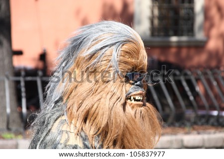 WARSAW, POLAND - JUNE 16: Chewbacca, the hero of Star Wars film, walking the streets of Warsaw, greeting fans who came to the Euro 2012, on June 16, 2012 in Warsaw, Poland.