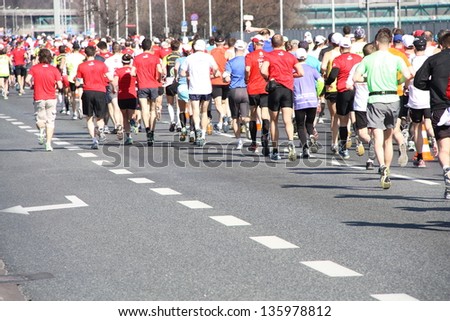 WARSAW - APRIL 21: Unidentified participants of the Orlen Warsaw Marathon are running through the streets of Polish capital. April 21, 2013 in Warsaw, Poland.