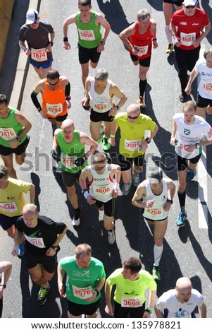 WARSAW - APRIL 21: Unidentified participants of the Orlen Warsaw Marathon are running through the streets of Polish capital. April 21, 2013 in Warsaw, Poland.