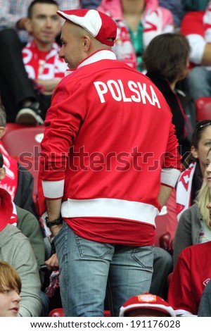WARSAW - SEPTEMBER 6: Football fans of Poland during the 2014 World Cup qualification match between Poland and Montenegro at the National Stadium on September 6, 2013 in Warsaw, Poland.