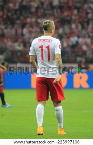 WARSAW, POLAND - OCTOBER 11, 2014: Kamil Grosicki in action (Polish team and French Ligue 1club Stade Rennais player) during the UEFA EURO 2016 qualifying match of Poland vs. Germany