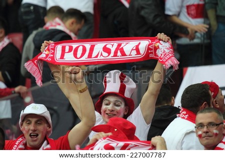 WARSAW, POLAND - OCTOBER 11, 2014: Unidentified Polish fans in action during the UEFA EURO 2016 qualifying match of Poland vs. Germany