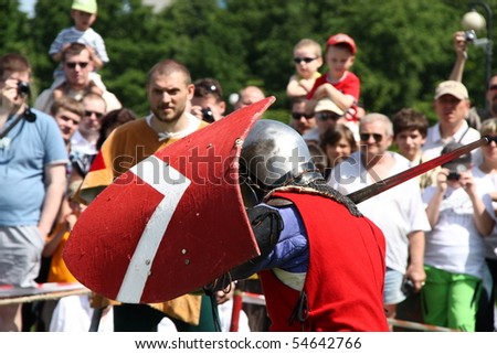 WARSAW, POLAND - JUNE 6: Struggle medieval knights during XV Knight Tournament on June 6, 2010 in Warsaw, Poland.