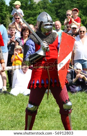 WARSAW, POLAND - JUNE 6: Struggle medieval knight during XV Knight Tournament on June 6, 2010 in Warsaw, Poland.