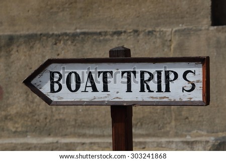 Boat Trip sign on the wall background