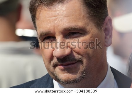 WARSAW, POLAND - AUGUST 06, 2015: Piotr Duda, leader of Solidarity trade union during a meeting with people on the street of Warsaw..