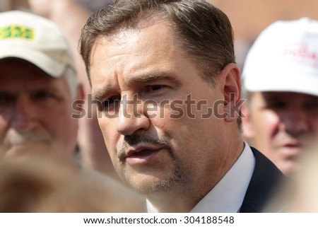 WARSAW, POLAND - AUGUST 06, 2015: Piotr Duda, leader of Solidarity trade union during a meeting with people on the street of Warsaw..