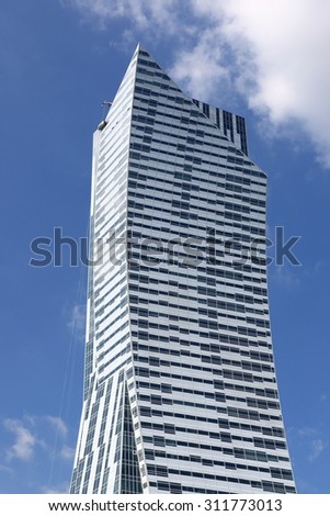 WARSAW, POLAND - AUGUST 29, 2015: Modern residential skyscraper in central Warsaw, Poland. It was designed by the Polish-born American architect Daniel Libeskind.
