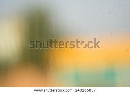 Abstract defocused colorful blurred background through the Looking Glass