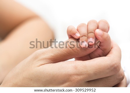 Happy moment ,Baby hand holding mother finger