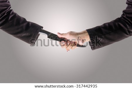 Business Man Shake hands with a business man Knife hand ,Business recreant or business betray  concept, with Clipping Path