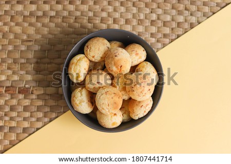 Cheese breads and cassava flour. Traditional from northern Argentina. Yellow and gray background
