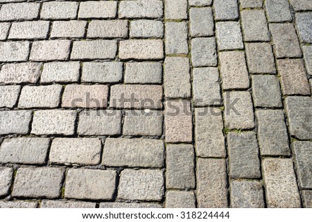 Isolated shot of an old England cobblestone road surface.  Also known as a cobbled road, or cobbles.