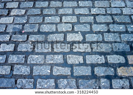 Isolated shot of an old England cobblestone road surface.  Also known as a cobbled road, or cobbles.