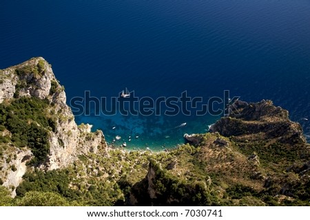 Clear blue sea off of the rocky coast of the Isle of Capri, Italy