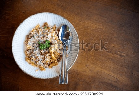 Similar – Image, Stock Photo South italian  pasta orecchiette with tomato sauce and cacioricotta cheese