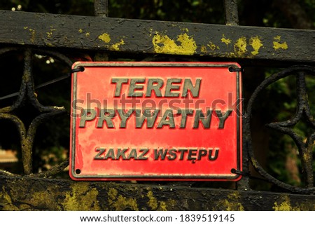 'Teren prywatny' means private area in polish language. Private area red sign on a fence. Zdjęcia stock © 