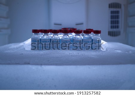 pool of covid 19 vaccines in a sub-zero ice block for preservation and transport