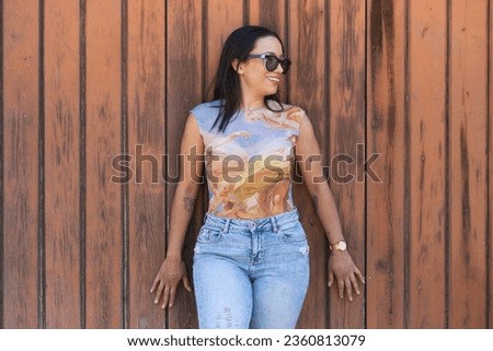 Similar – Image, Stock Photo Woman leaning against door in front of red wall