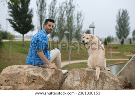 Similar – Image, Stock Photo Dog on the rocks at sunrise