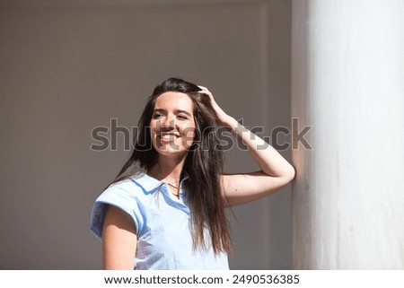 Similar – Image, Stock Photo Gorgeous woman touching columns in park