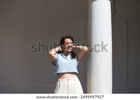 Similar – Image, Stock Photo Gorgeous woman touching columns in park