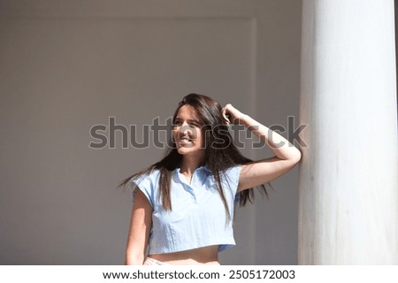 Similar – Image, Stock Photo Gorgeous woman touching columns in park