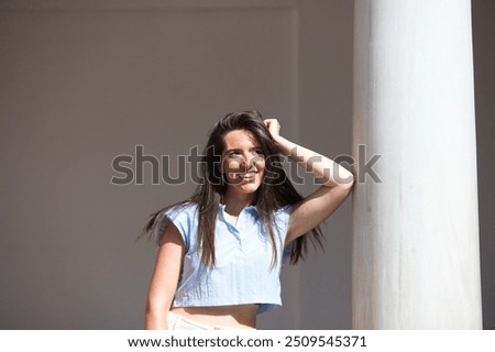 Similar – Image, Stock Photo Gorgeous woman touching columns in park