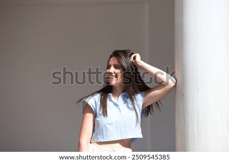 Similar – Image, Stock Photo Gorgeous woman touching columns in park