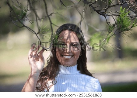 Similar – Image, Stock Photo woman among the branches of a golden tree in autumn