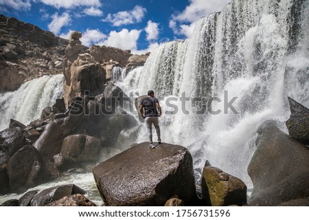 Similar – Image, Stock Photo Traveling man near waterfall in mountains