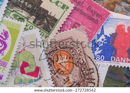 Stamp collage from different countries.   A variety of stamps in different colors and sizes from different countries