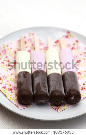 Close-up of delicious ice-cream sticks with chocolate coating